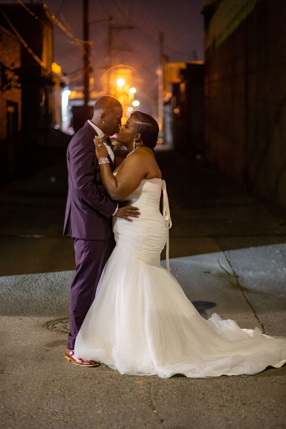 Love and romance captured in a tender kiss between the beautiful bride and her dashing groom on their special day.