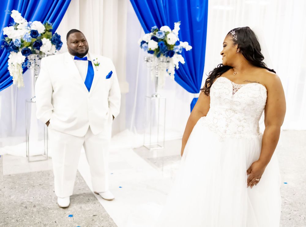 Mesmerizing shot capturing the bride's affectionate gaze as she looks back at her beloved groom.