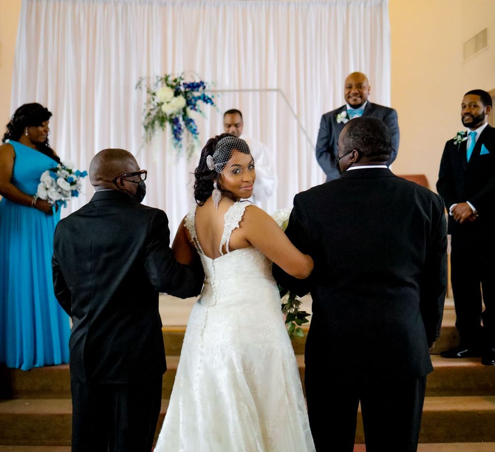 Wedding reception scene showing couples dancing together in formal attire.