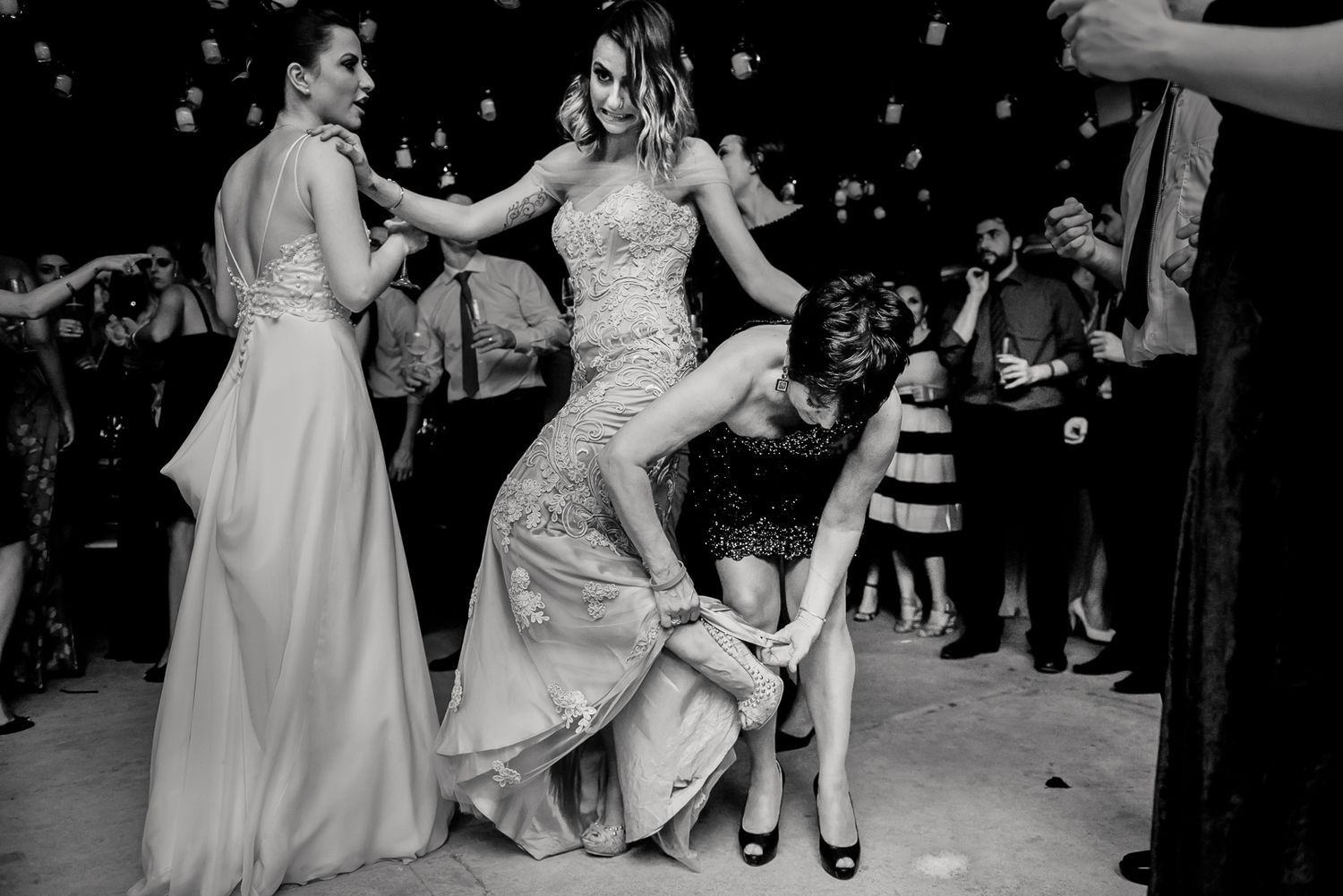 Guests dancing and celebrating at elegant wedding reception.