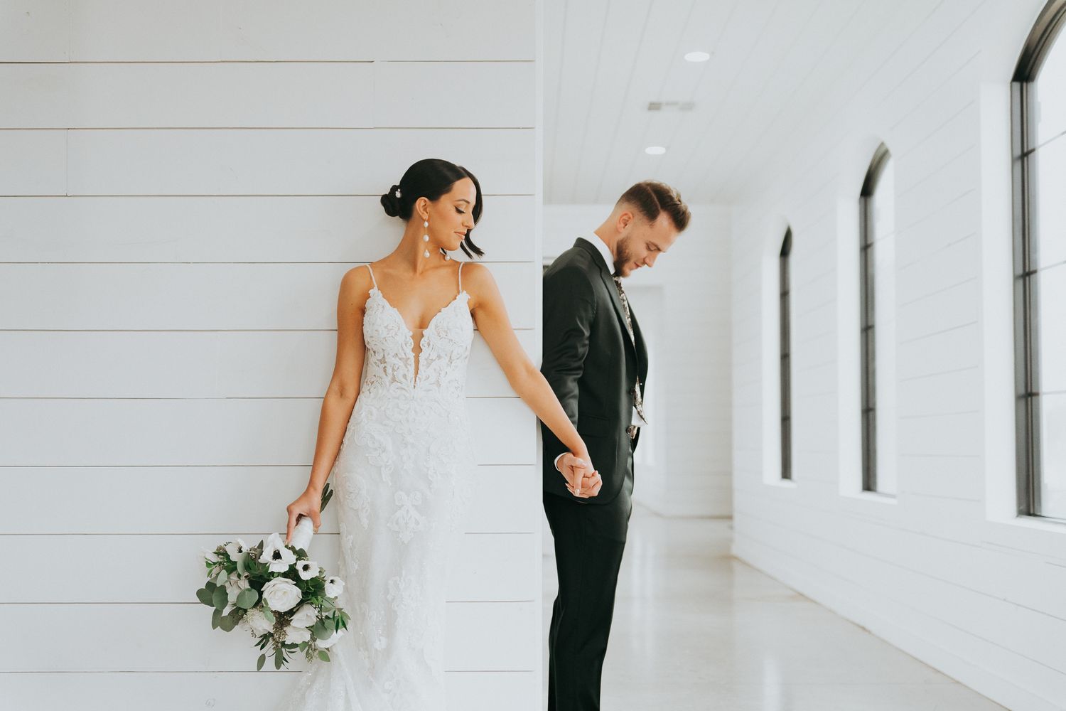 bride and groom praying during first look on wedding day. dallas texas wedding photographer.