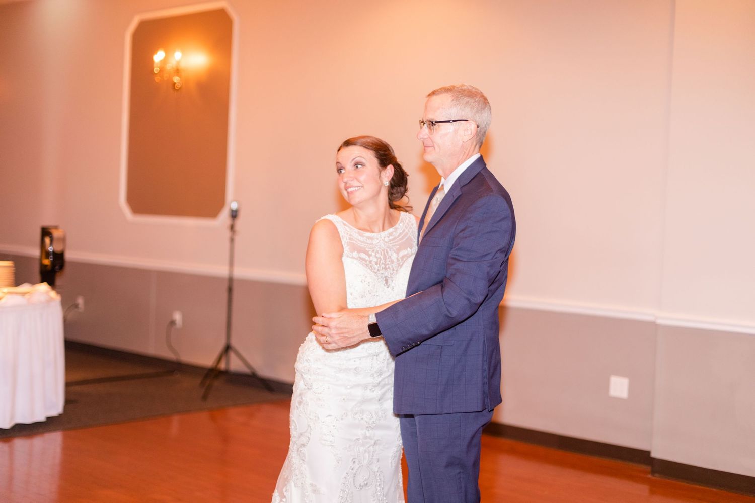 Couple sharing an intimate dance moment at their wedding reception.