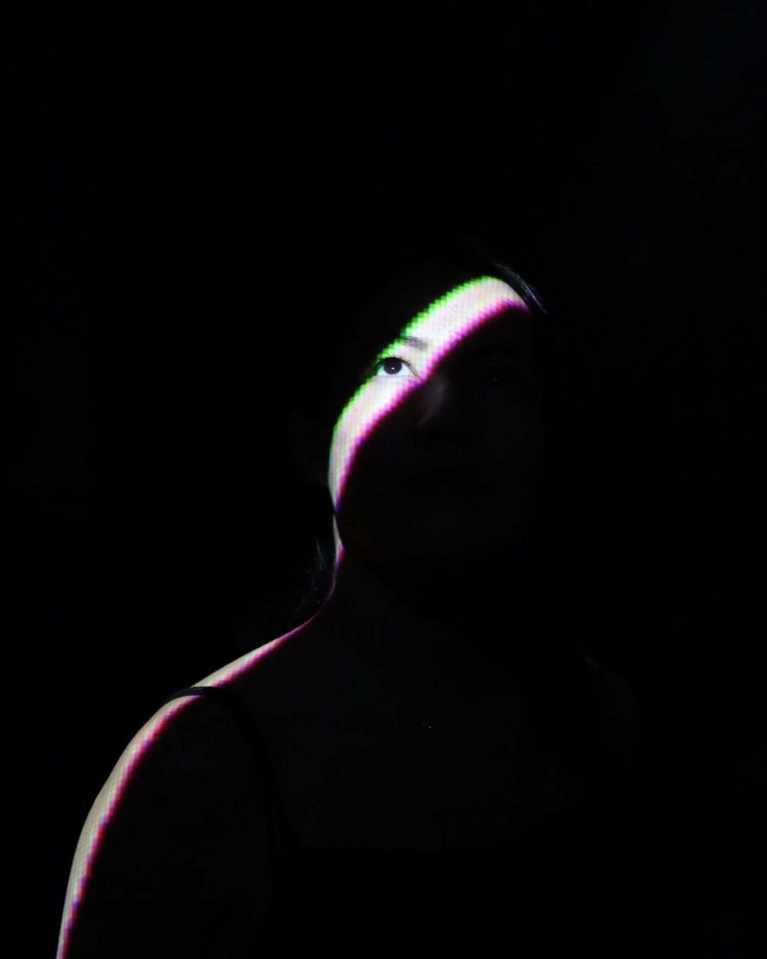 Dramatic black and white profile silhouette with neon accents.