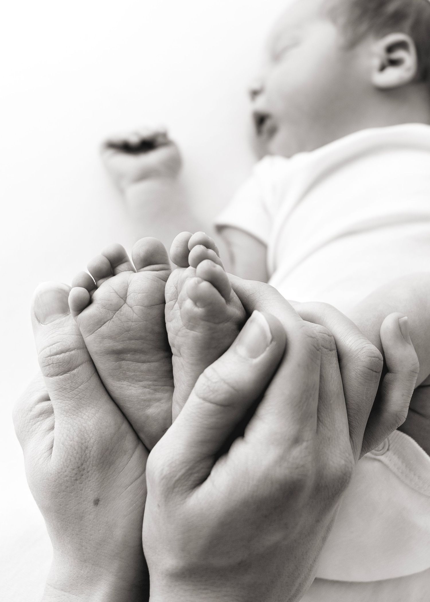 Newborn photography highlights cute baby feet, Victoria BC
