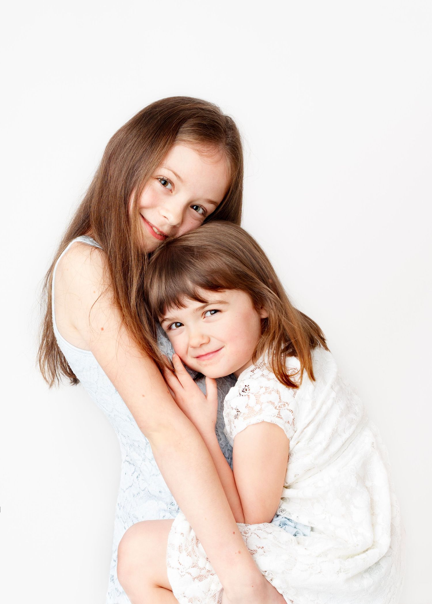 Sisters hugging at family photography studio Victoria BC