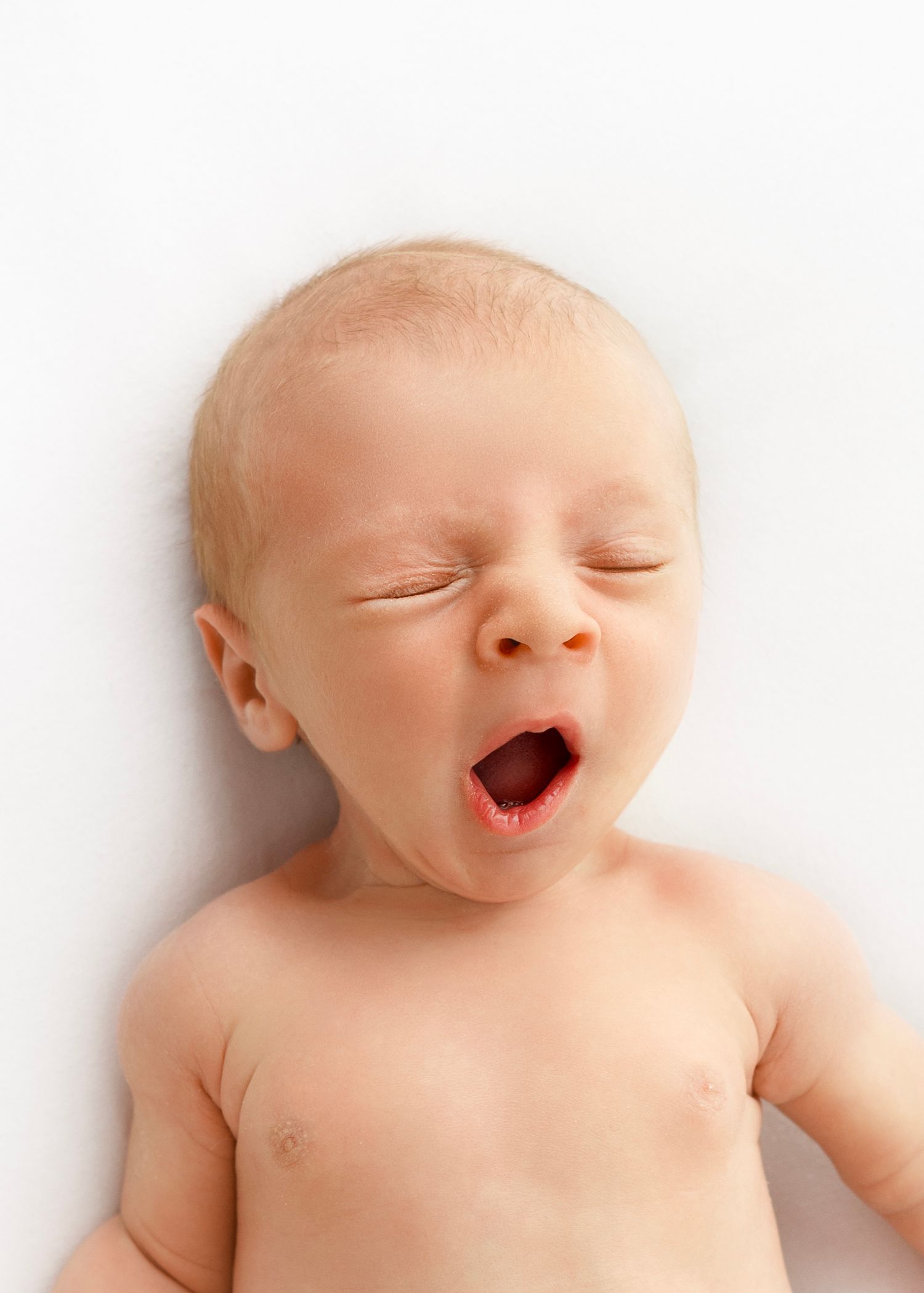 baby yawning at natural newborn photography photoshoot