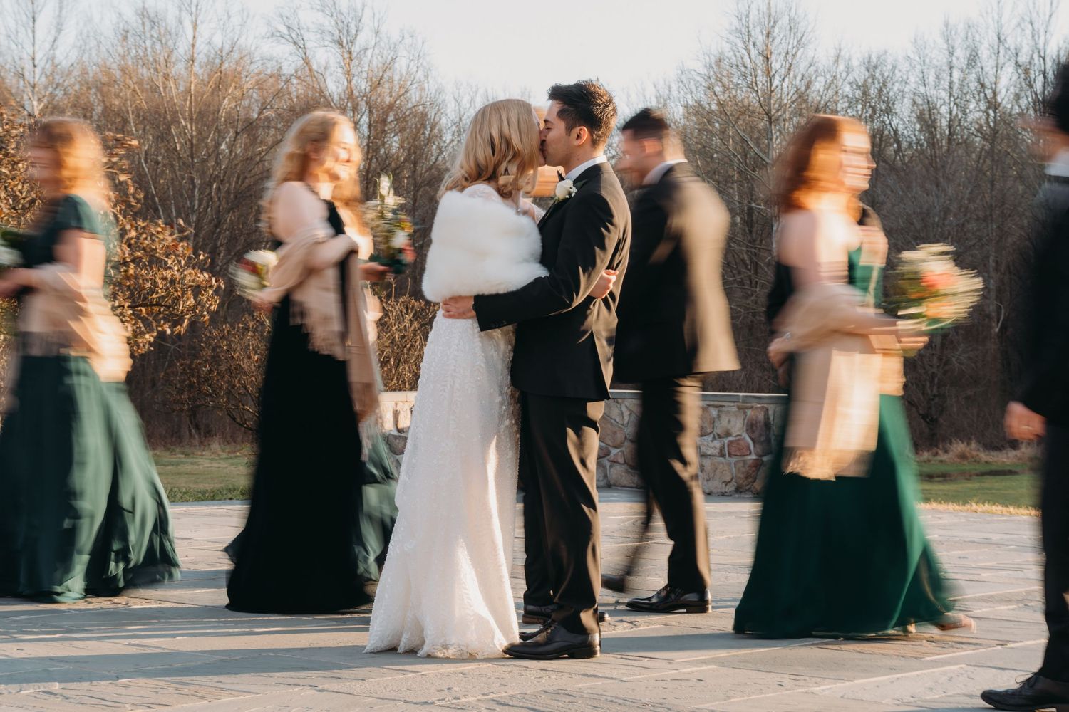 bride and groom kiss in wedding blur trend