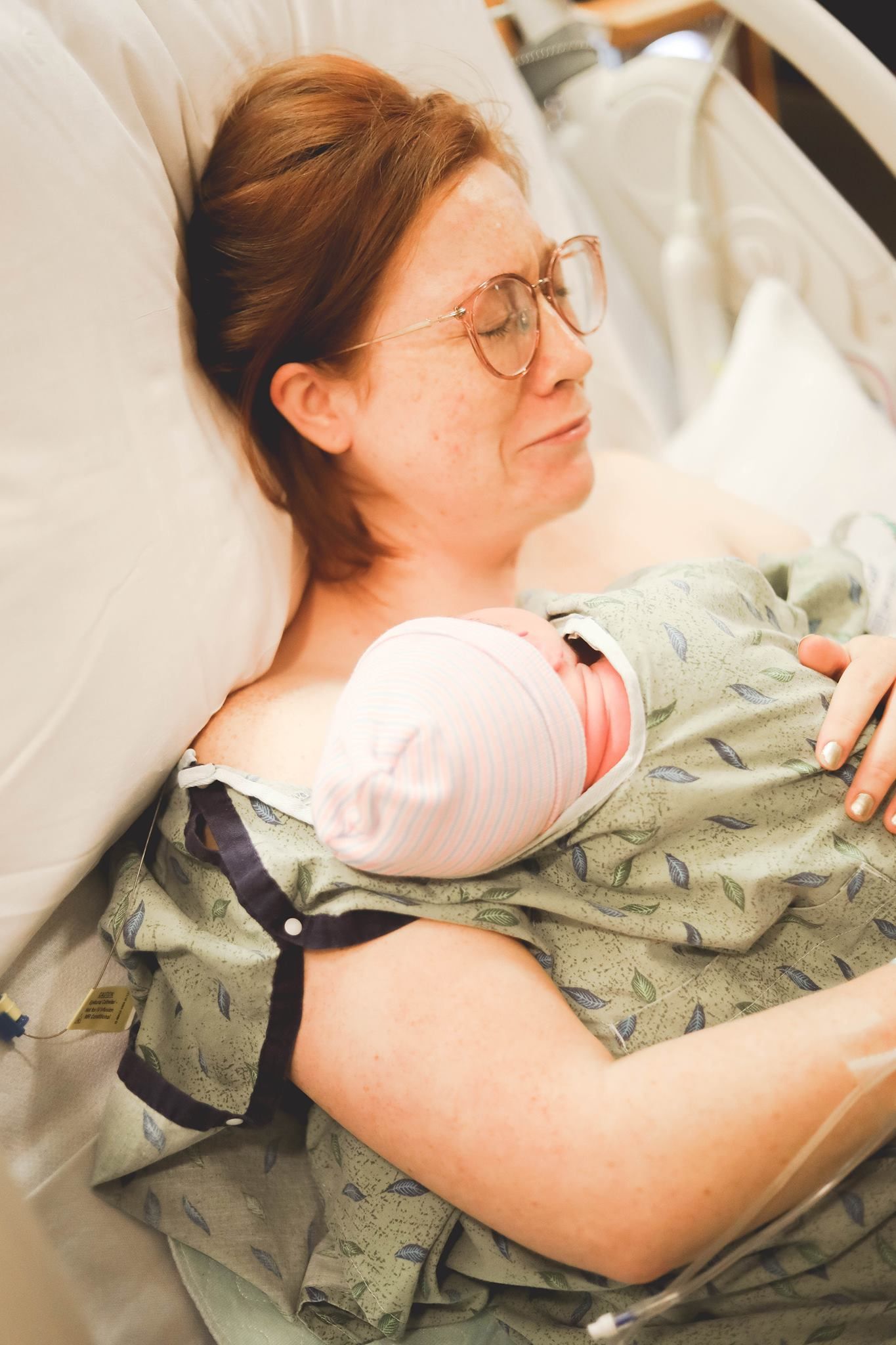 Tucson Fresh 48 session featuring a mother bonding with her newborn on her chest in the hospital room.
