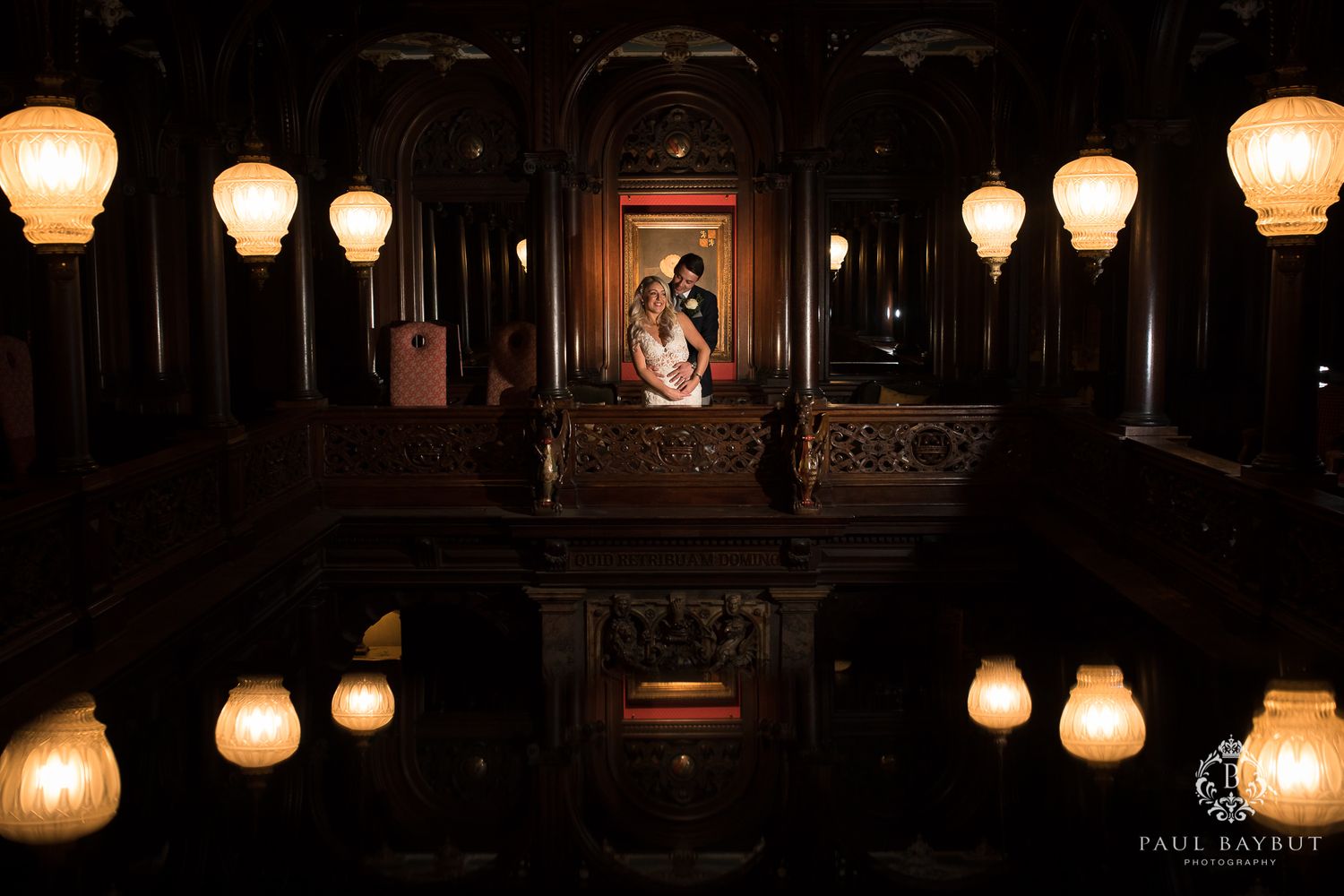 Atmospheric night portrait with glowing vintage lamps creating romantic reflections.