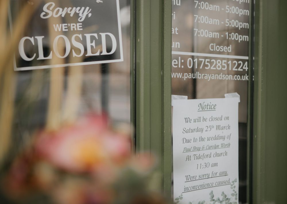 shop closed for a wedding sign