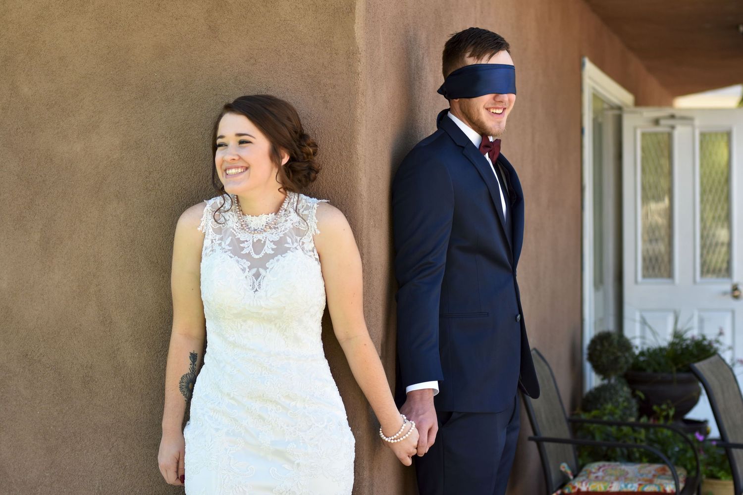Excited couple holding hands