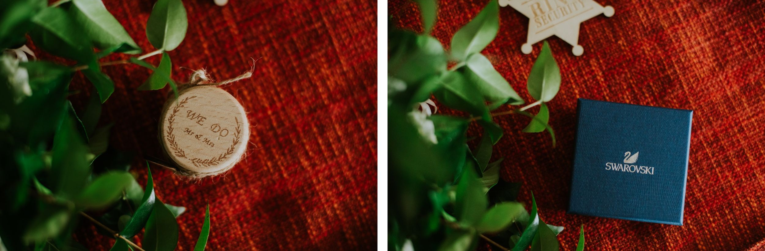 Wedding rings and jewelry box arranged on red textured surface with greenery.