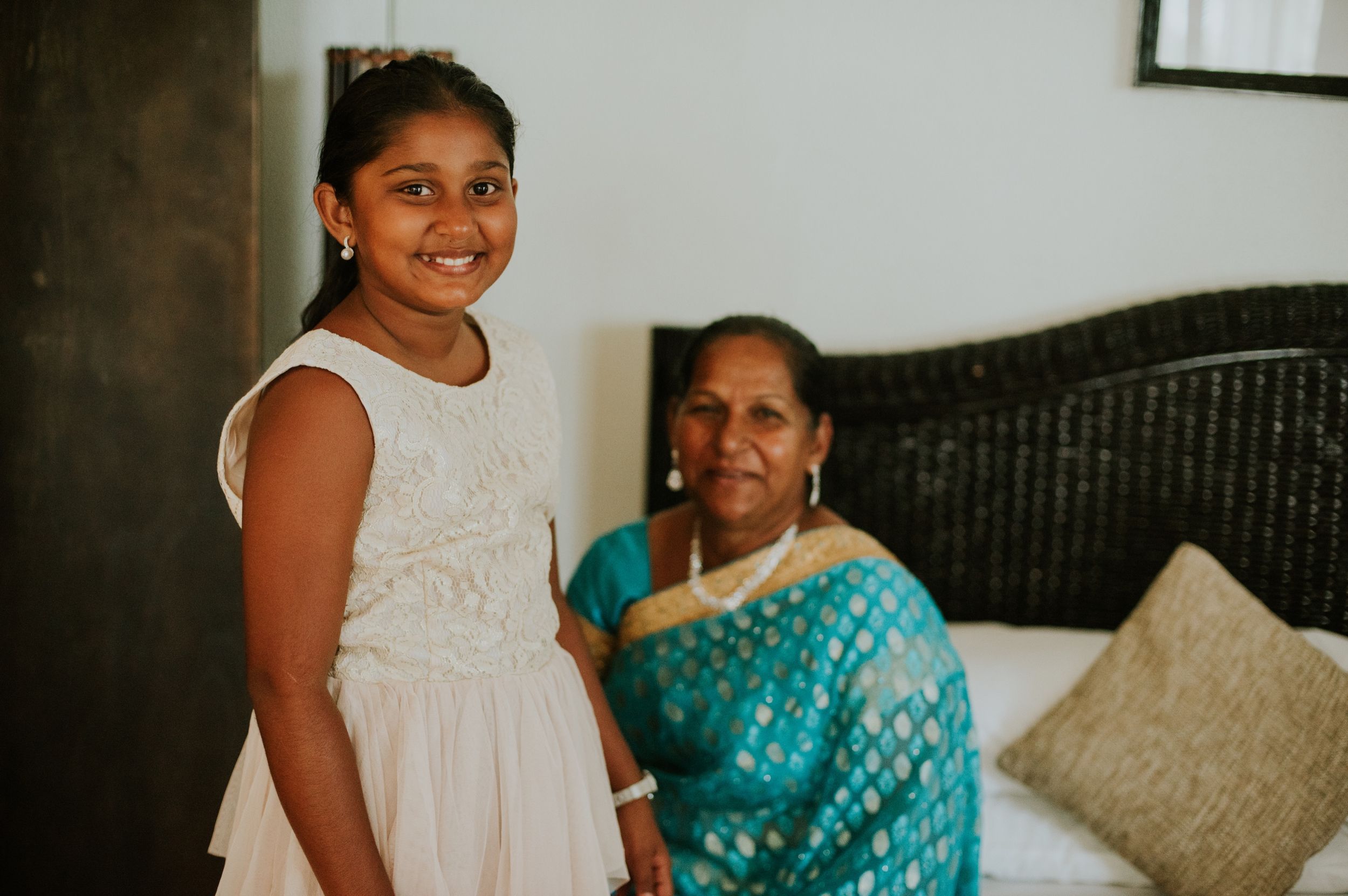 Traditional Indian wedding preparation scene in home setting.