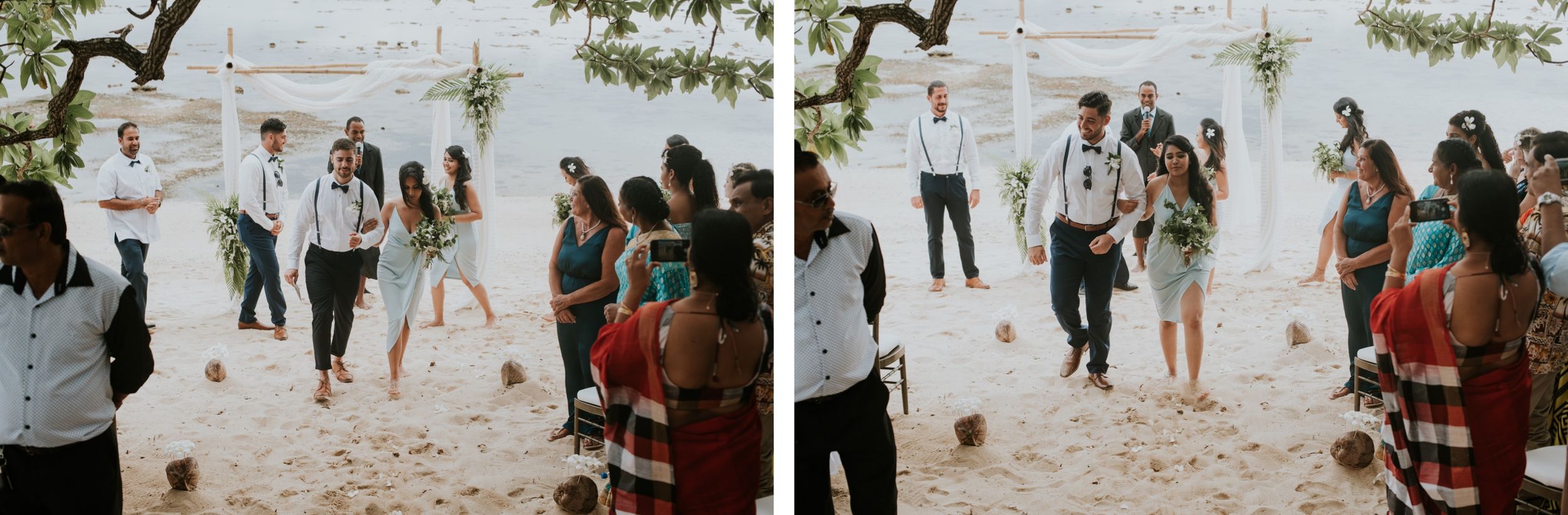 Wedding celebration with guests jumping and dancing playfully on a tropical beach.