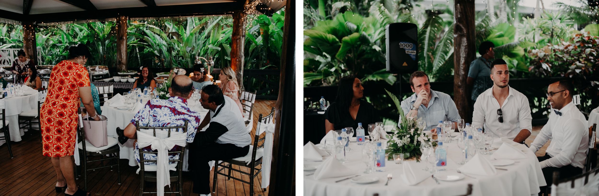 Elegant outdoor wedding reception setup with white tables under a covered pavilion surrounded by tropical greenery.