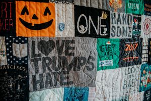 'Love Trumps Hate' is front and centre in a memory patchwork quilt made from children's clothing.