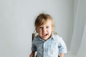A toddler boy laughing at the camera. Greenville, SC newborn photographer, Easley, SC Newborn photographer