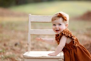 Little girl leaning against a chair. Greenville, SC newborn photographer, Easley, SC Newborn photographer