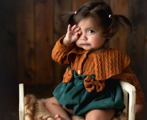 A toddler girl wiping her tears. Greenville, SC newborn photographer, Easley, SC Newborn photographer