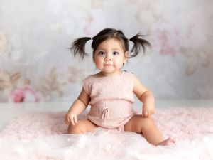 A Hispanic little girl with pigtails. Greenville, SC newborn photographer, Easley, SC Newborn photographer
