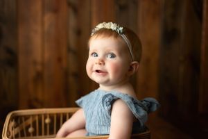 A 6-month-old redheaded girl in a basket. Greenville, SC newborn photographer, Easley, SC Newborn photographer