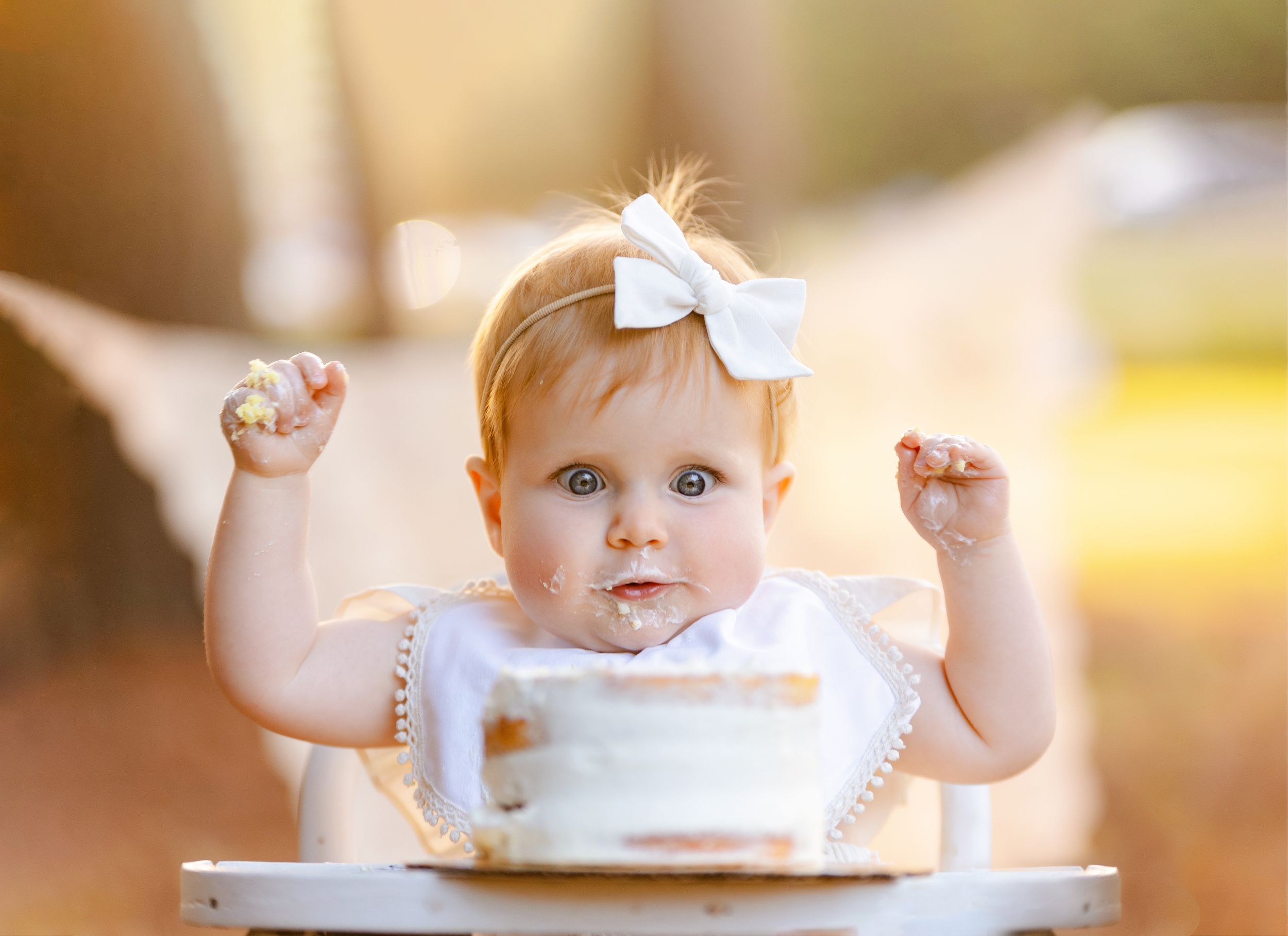One-year-old enjoying her smash the cake. Greenville, SC newborn photographer, Easley, SC Newborn photographer