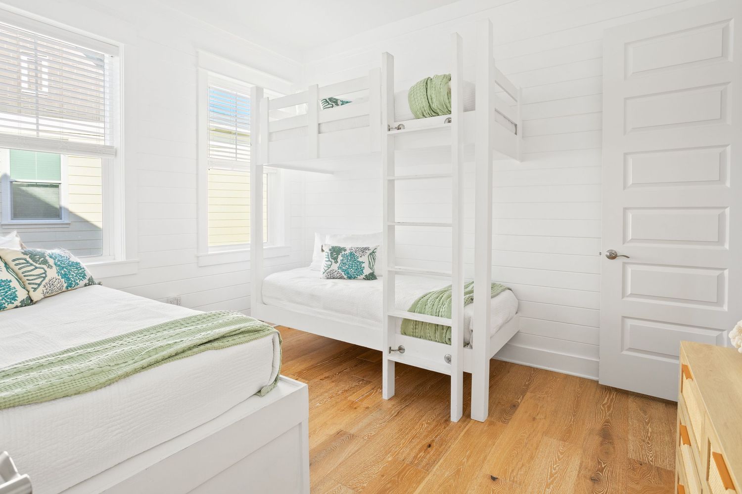 Cozy room with bunk beds capturing the essence of beach living in Alys Beach, FL.