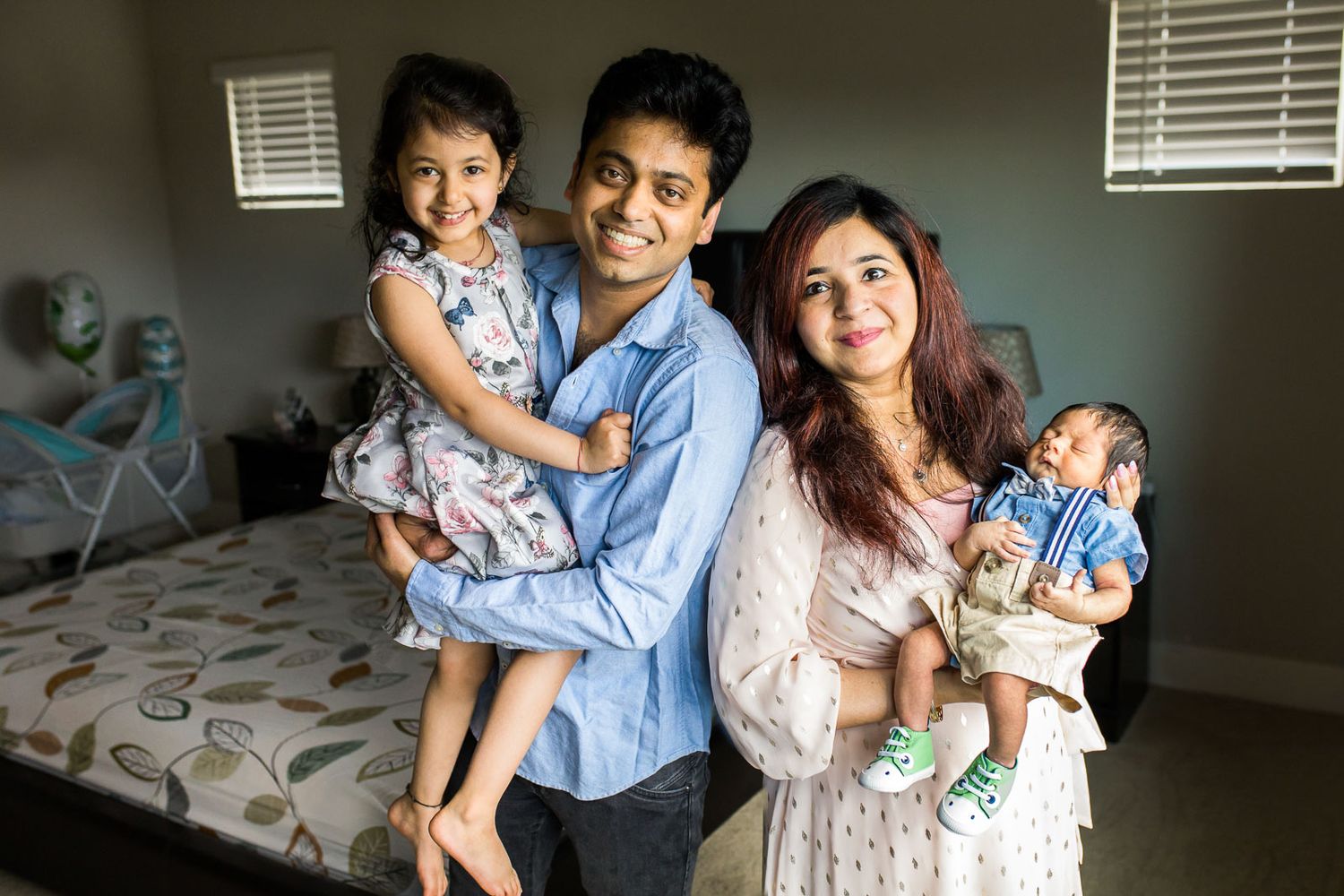A family hugging each other in Bothell for a newborn photography session