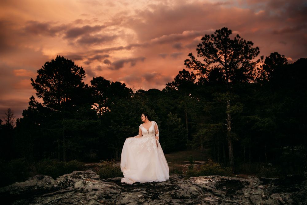 long shot of bride posing