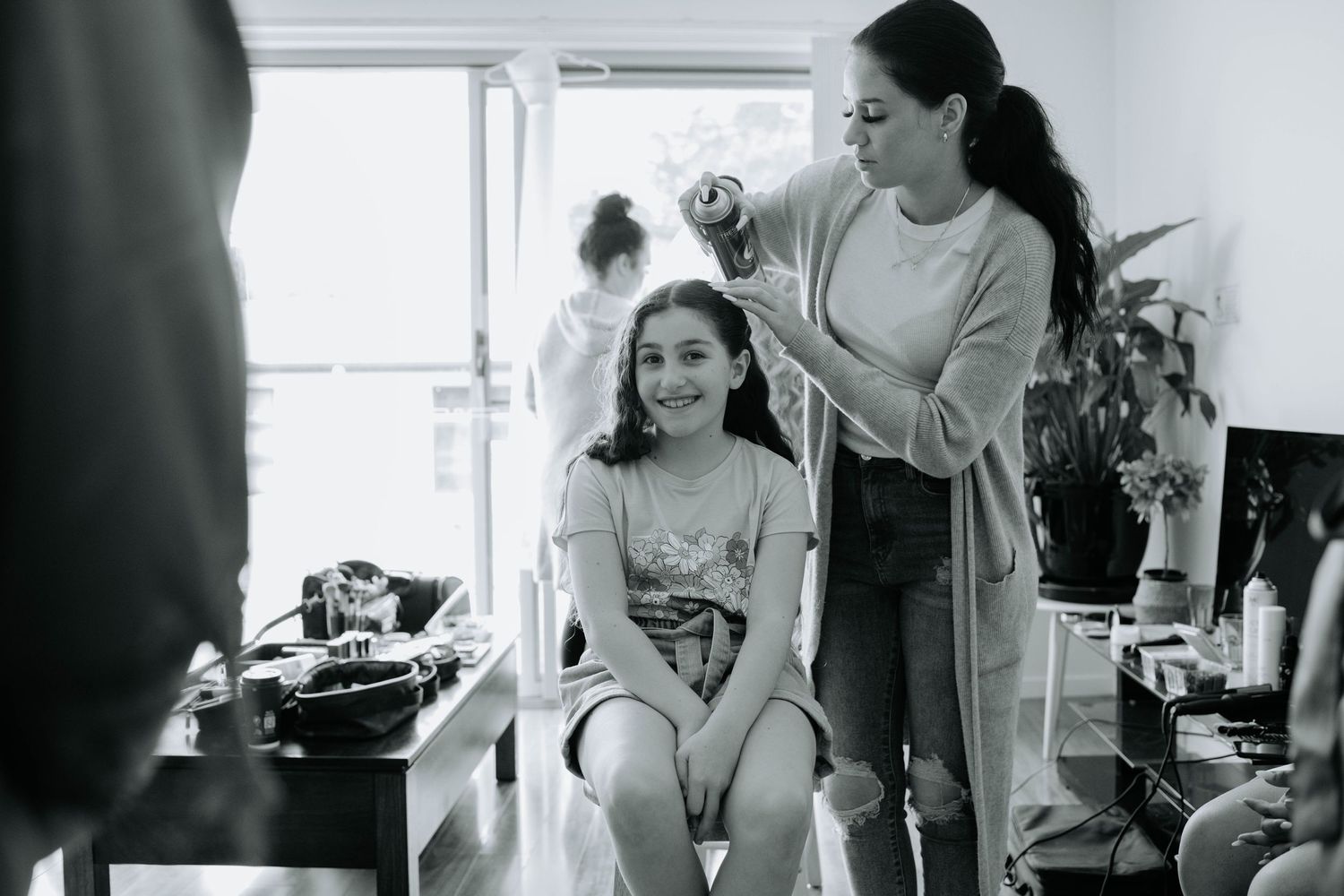Black and white photo of wedding preparation with styling session.