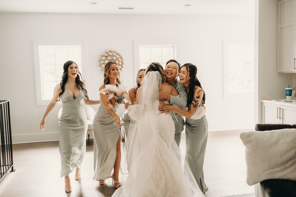 bridal team excited to see bride in wedding dress