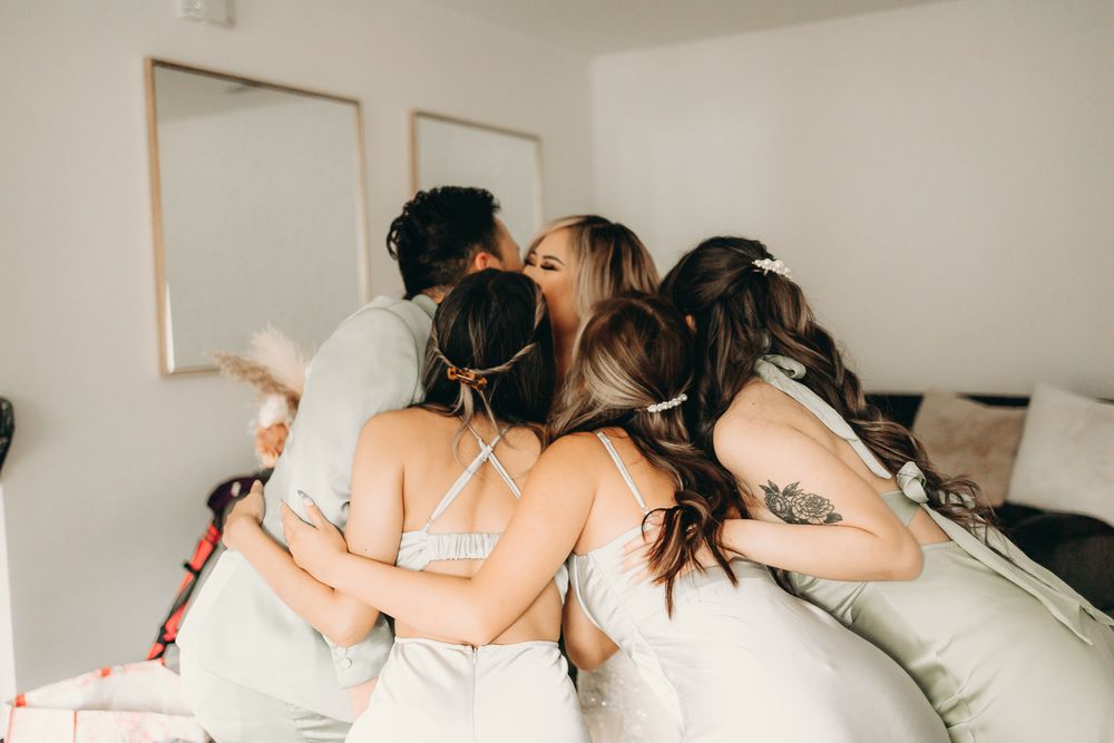 bridal team excited to see bride in wedding dress