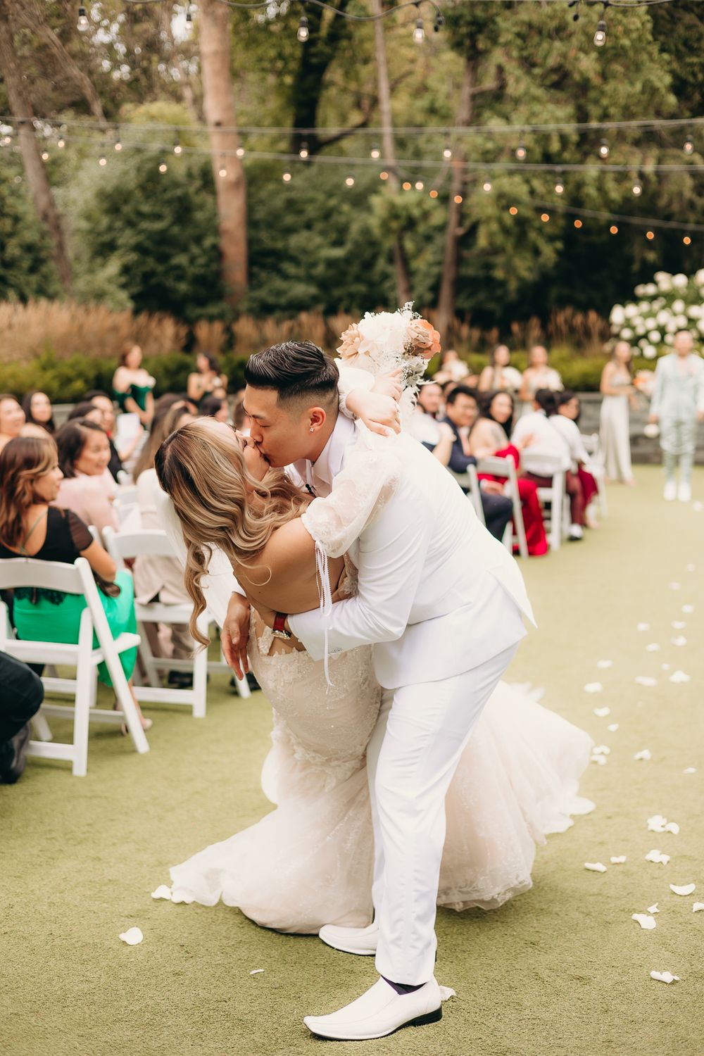 bride and groom doing a dip kiss