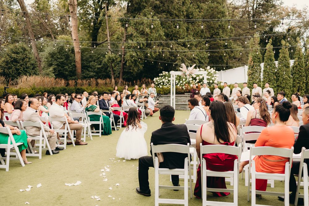 flower girl walking down the aisle