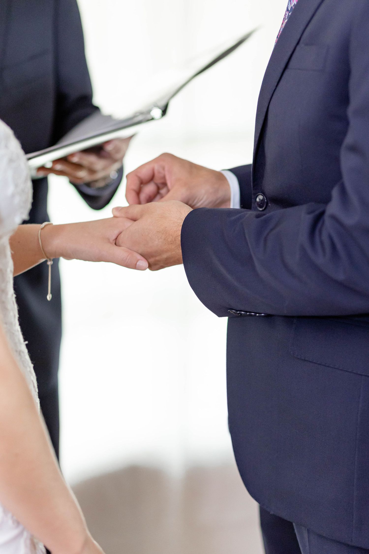 bride and groom exchange rings