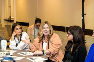 Attendees participate in an engaging discussion during a professional conference session.