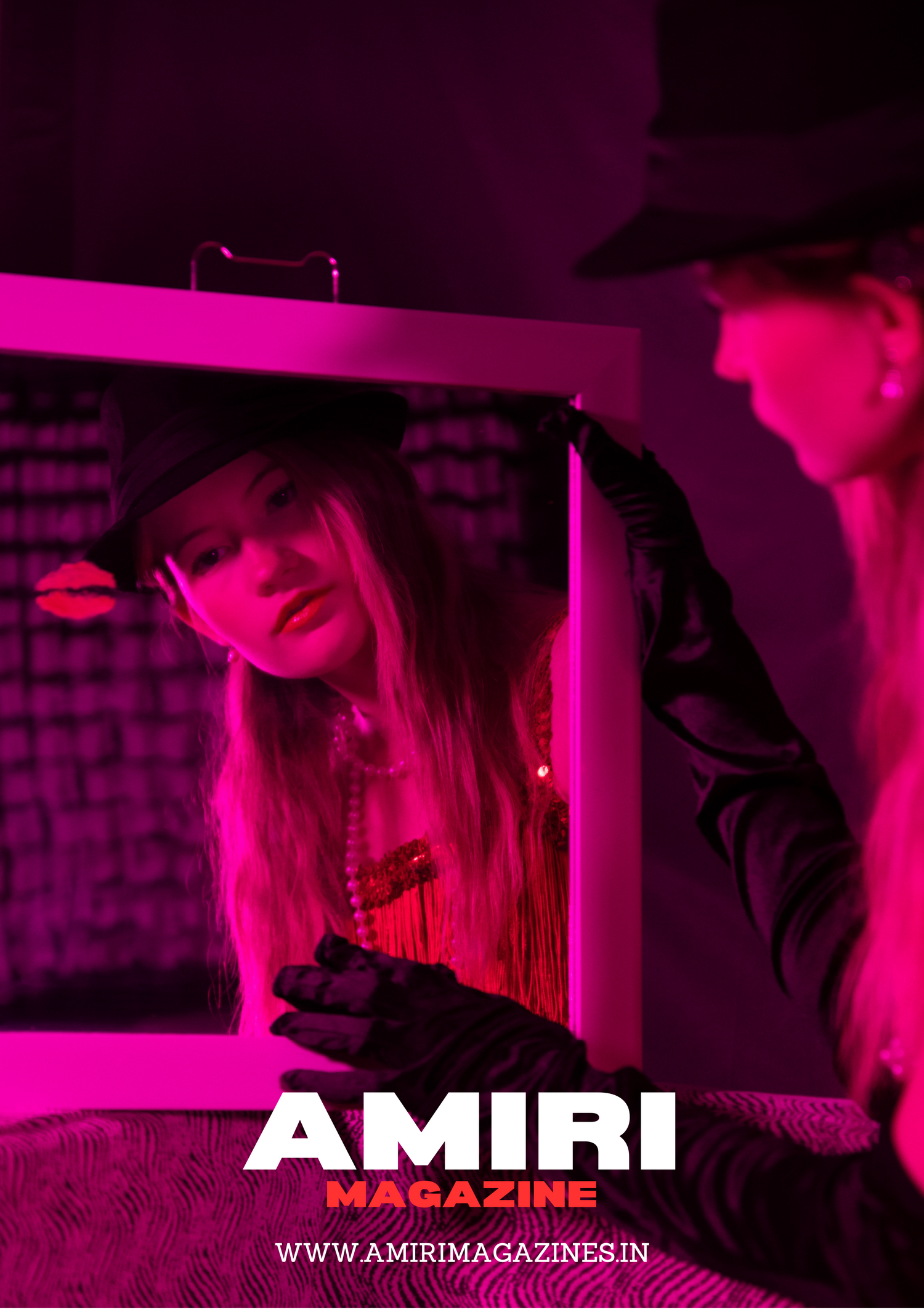 Fashion editorial photo with pink lighting showing model in vintage-inspired styling.