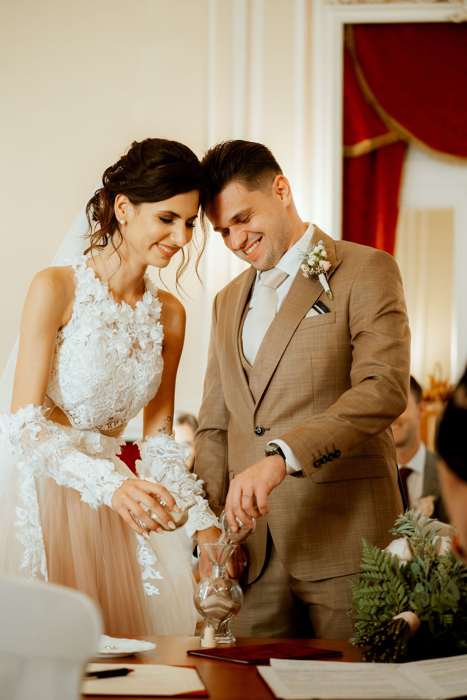 Wedding couple performing unity sand ceremony during their reception.