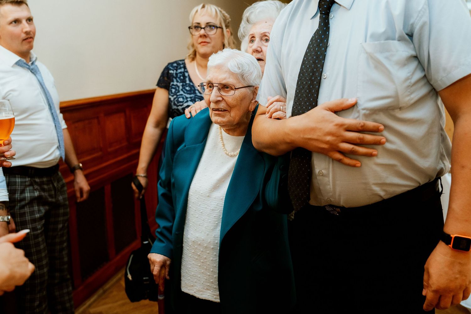 Wedding guests gather together during reception celebrations.