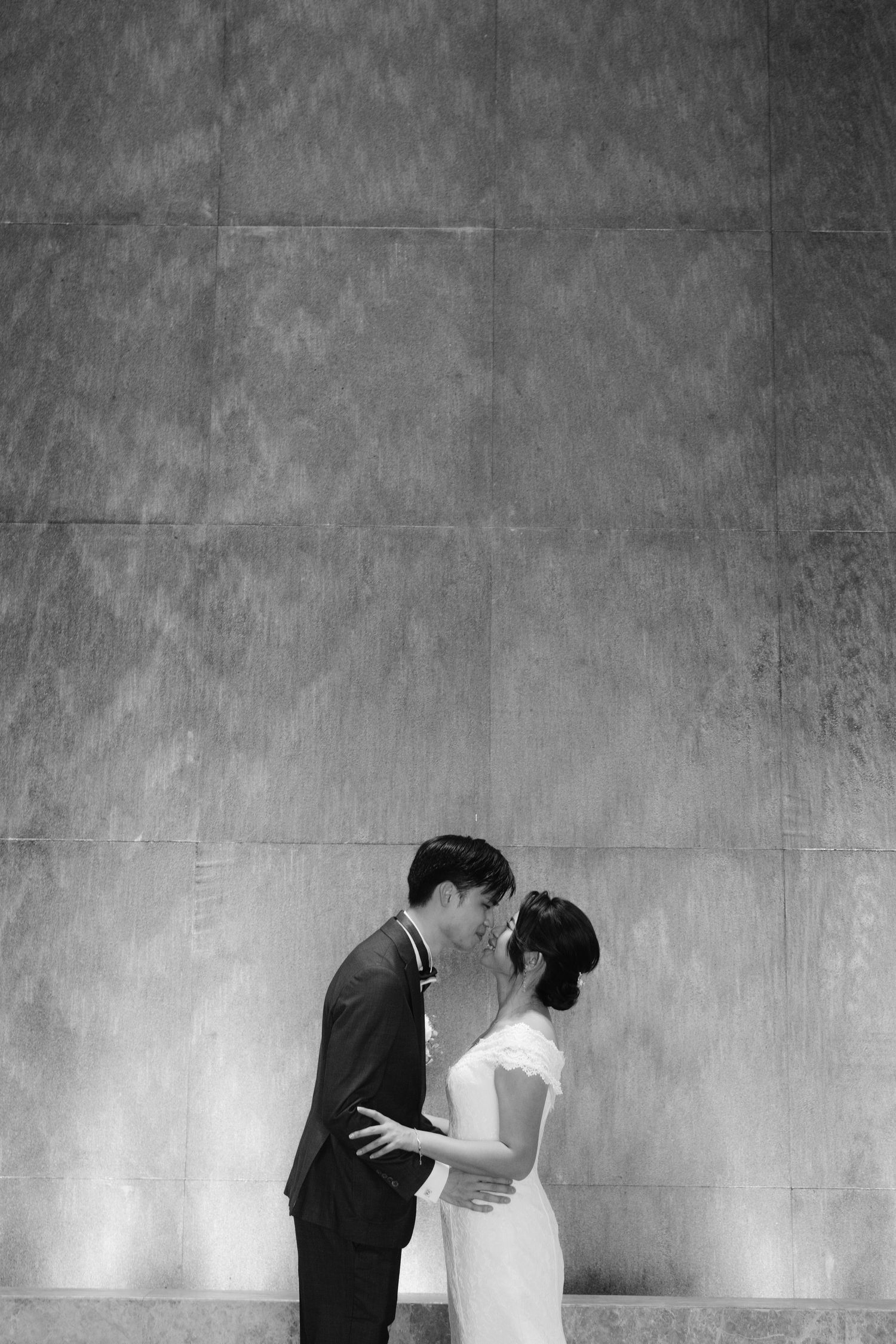 Intimate black and white wedding moments captured against an industrial backdrop.