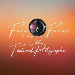 Fervent Focus Magazine 2021 Featured Photographer badge with camera lens on sunset background.