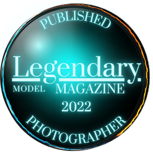 Legendary Model Magazine 2022 Published Photographer award badge with glowing teal circular design.