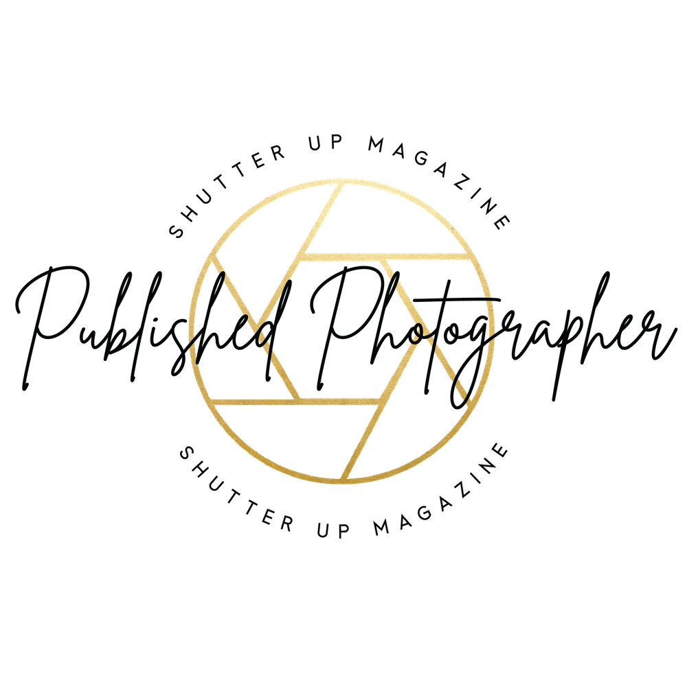 Shutter Up Magazine Published Photographer gold camera aperture logo in elegant script.