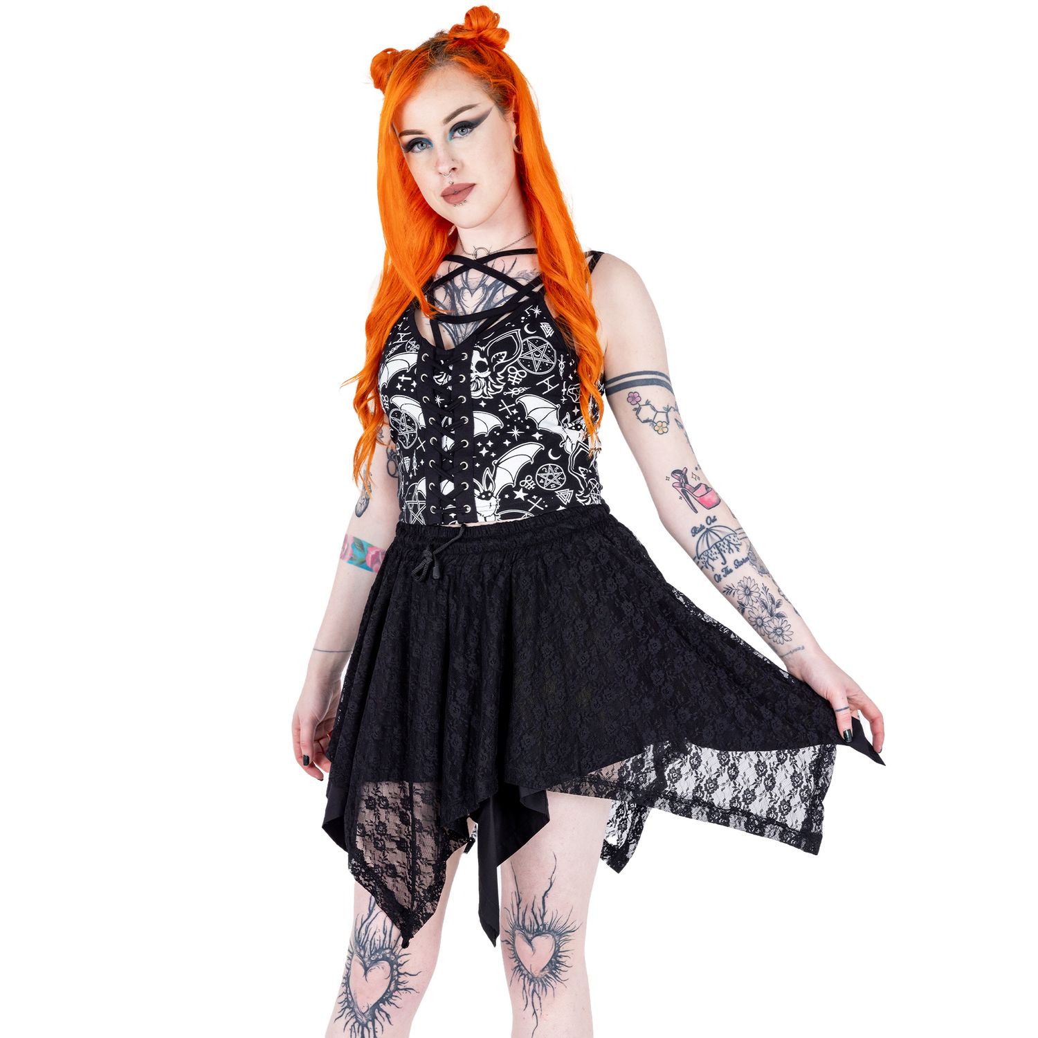Alternative emo styled tattooed femme model with orange hair for small fashion brand in a photography studio in Hove