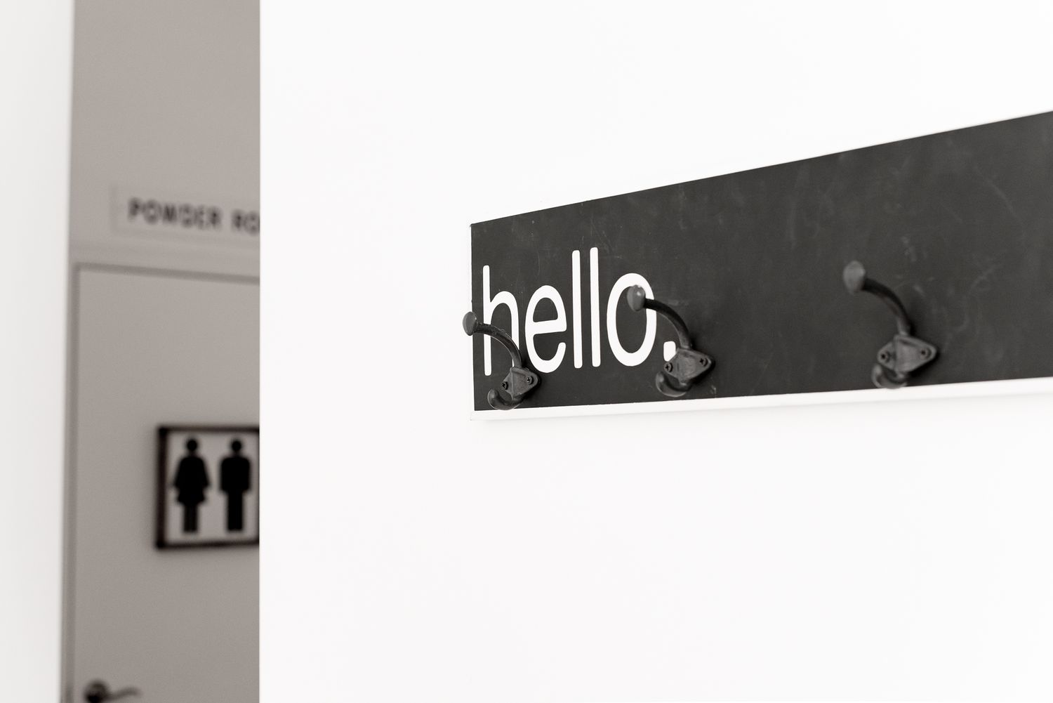 Hello coat rack inside natural light photography studio
