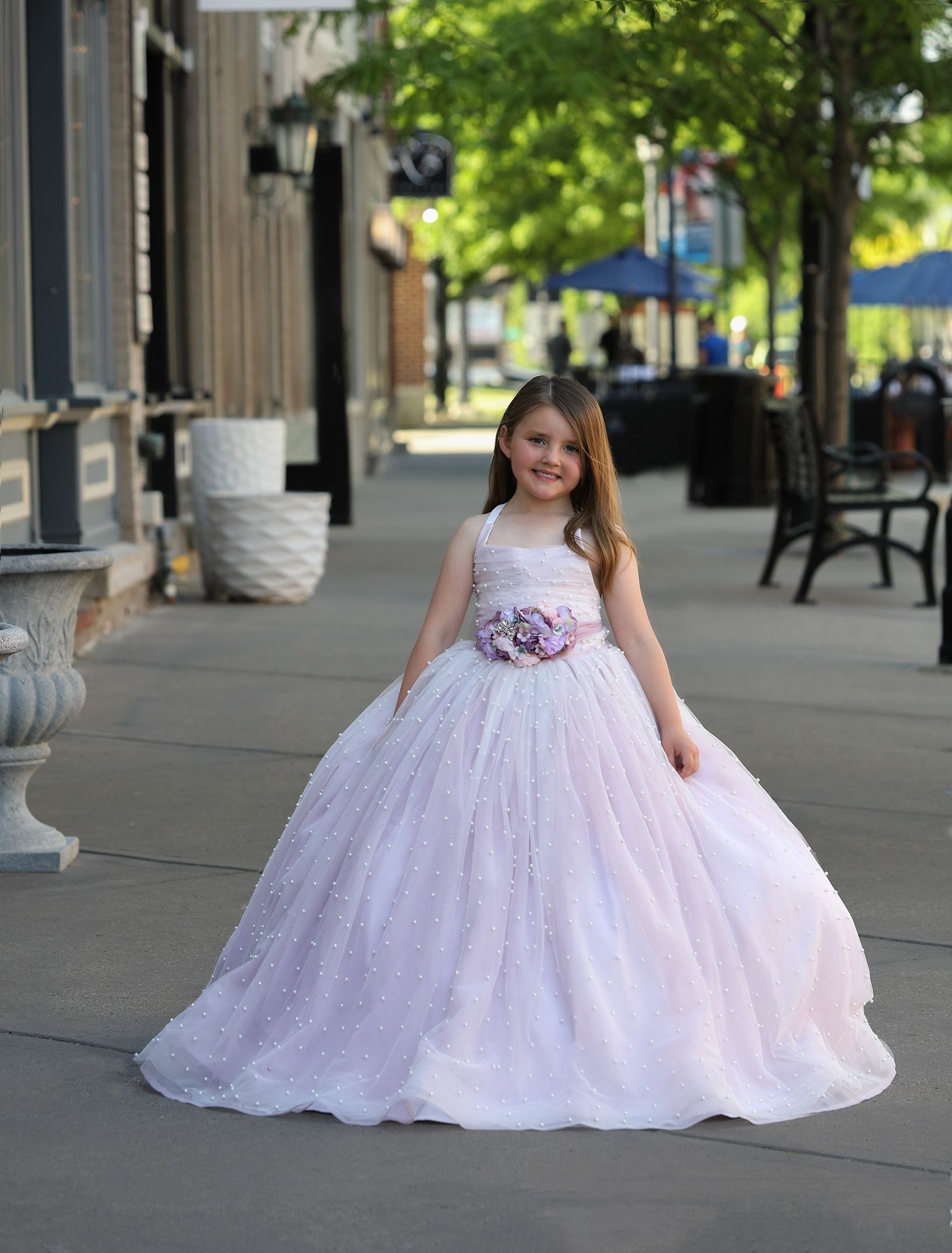 Small girl in pink couture gown in downtown Northville, MI