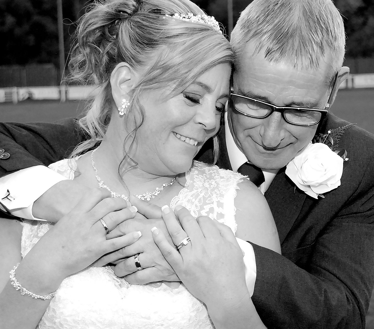 Groom hugging his Bride at their wedding in Warwickshire