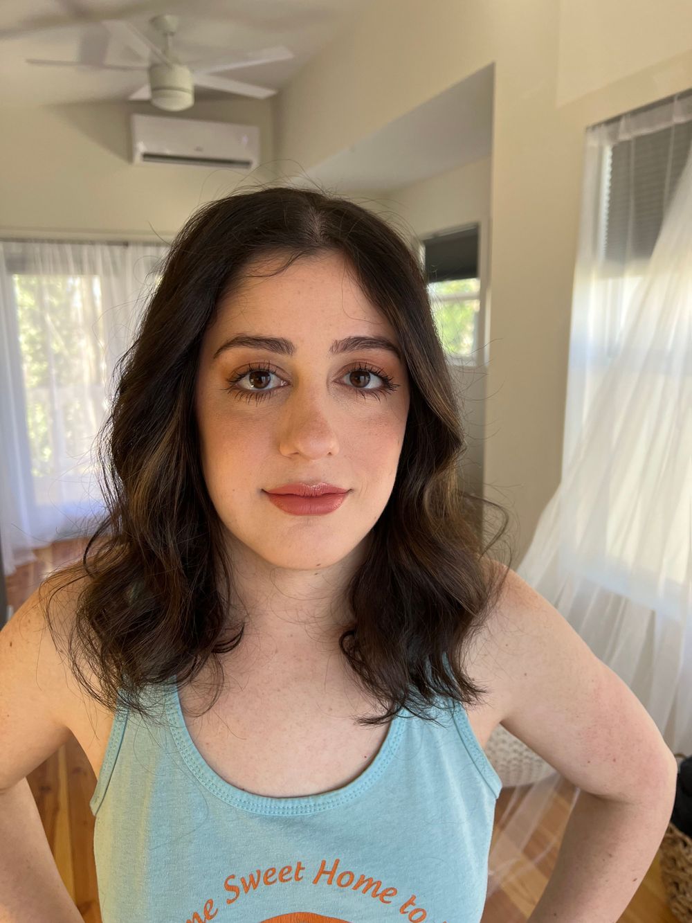 Indoor portrait series wearing casual blue tank top.