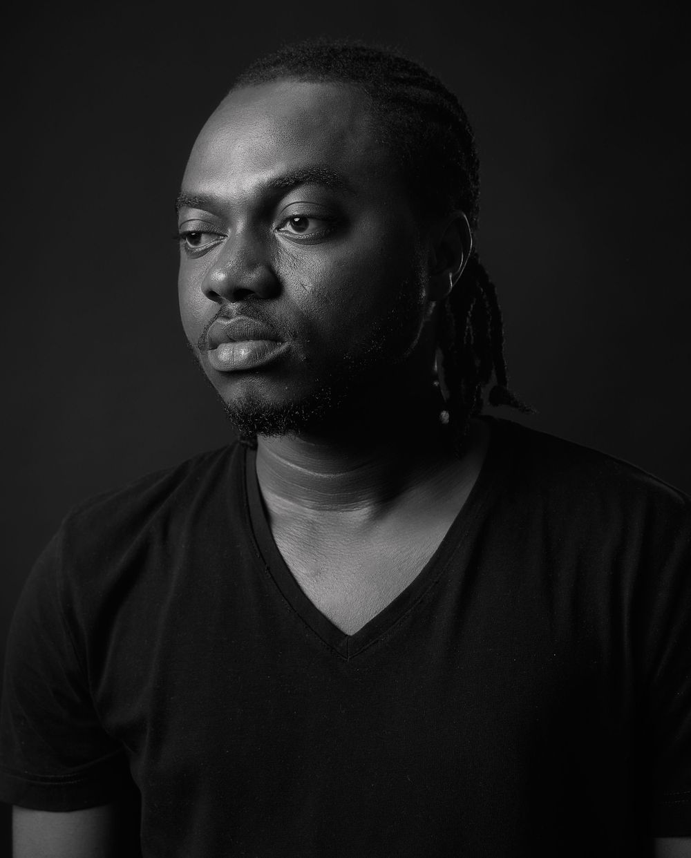 Dramatic black and white portrait series showing different angles and expressions.