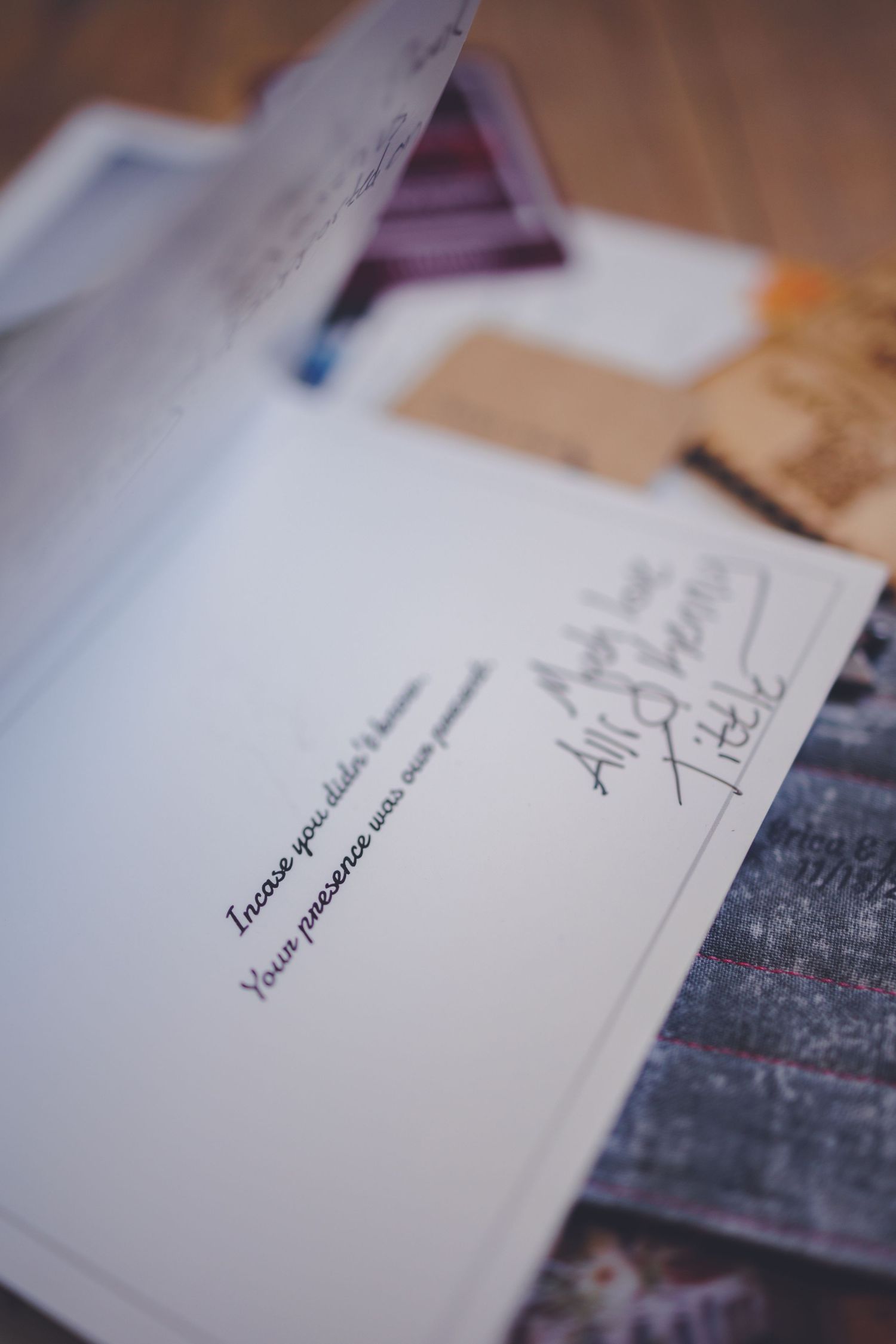 a thank you letter to Clay with other items in blurry background